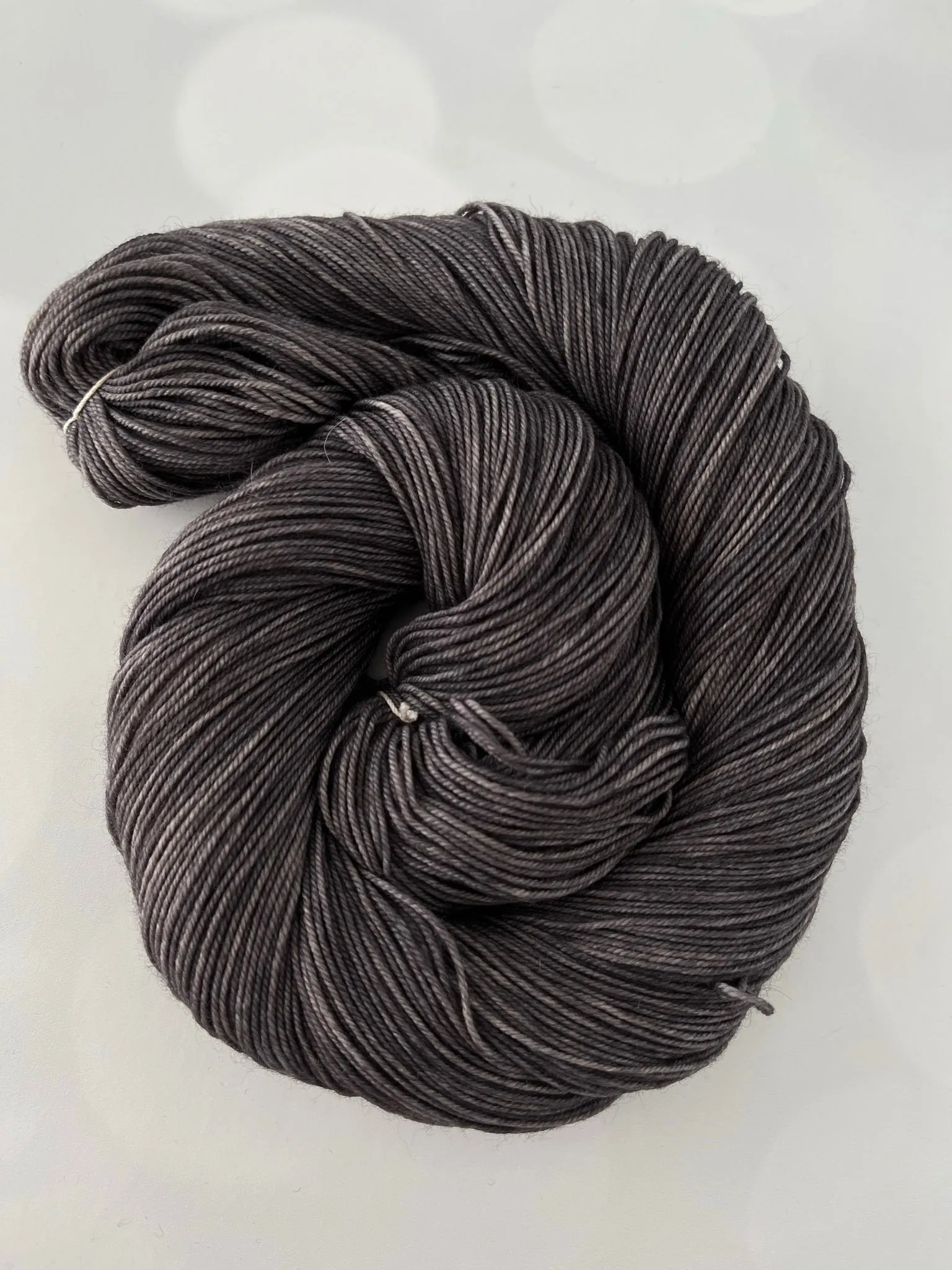 Gunpowder, Treasured Yak Toes Sock Yarn, dark charcoal gray yarn