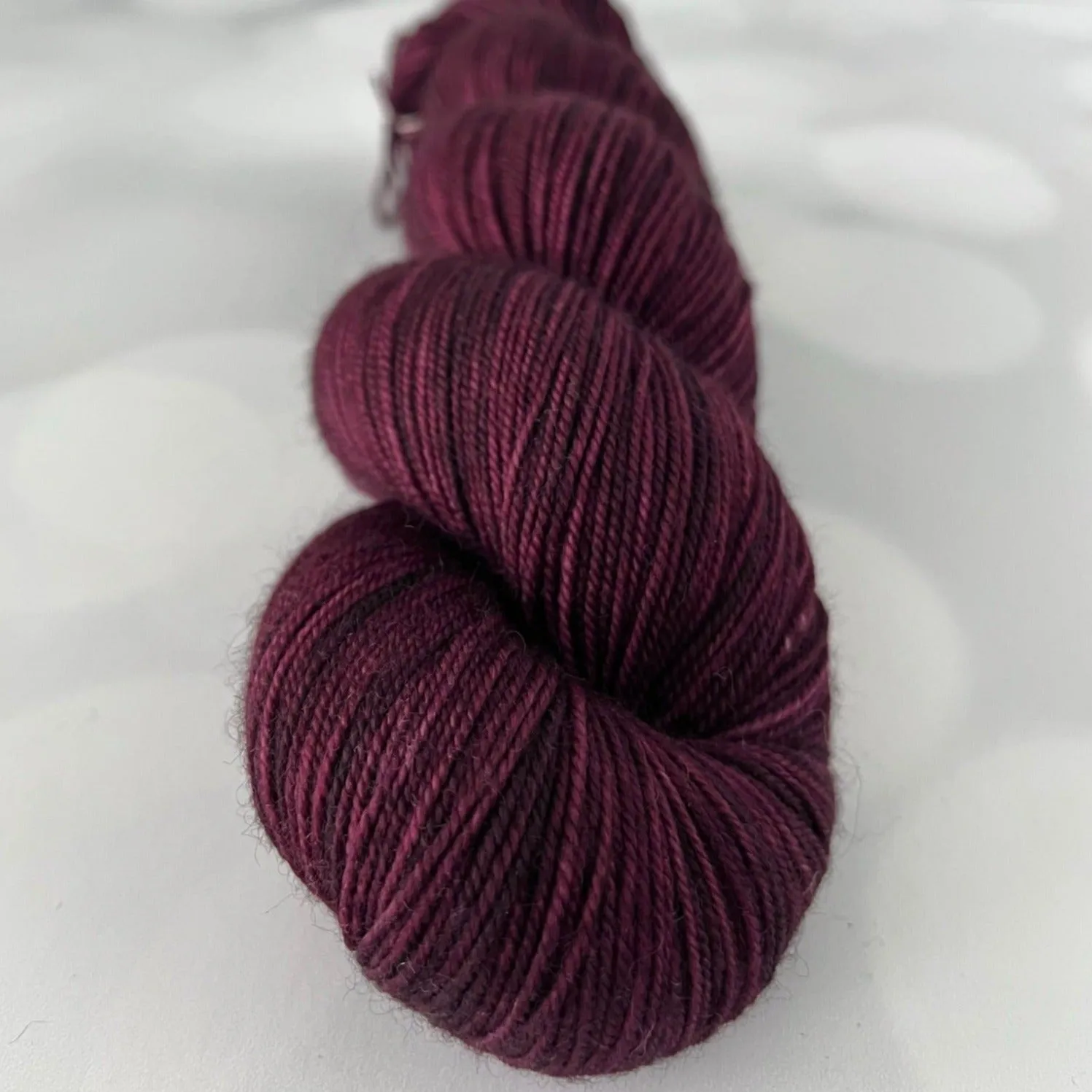 Song of the Sirens, Treasured Yak Toes Sock Yarn, magenta wine yarn