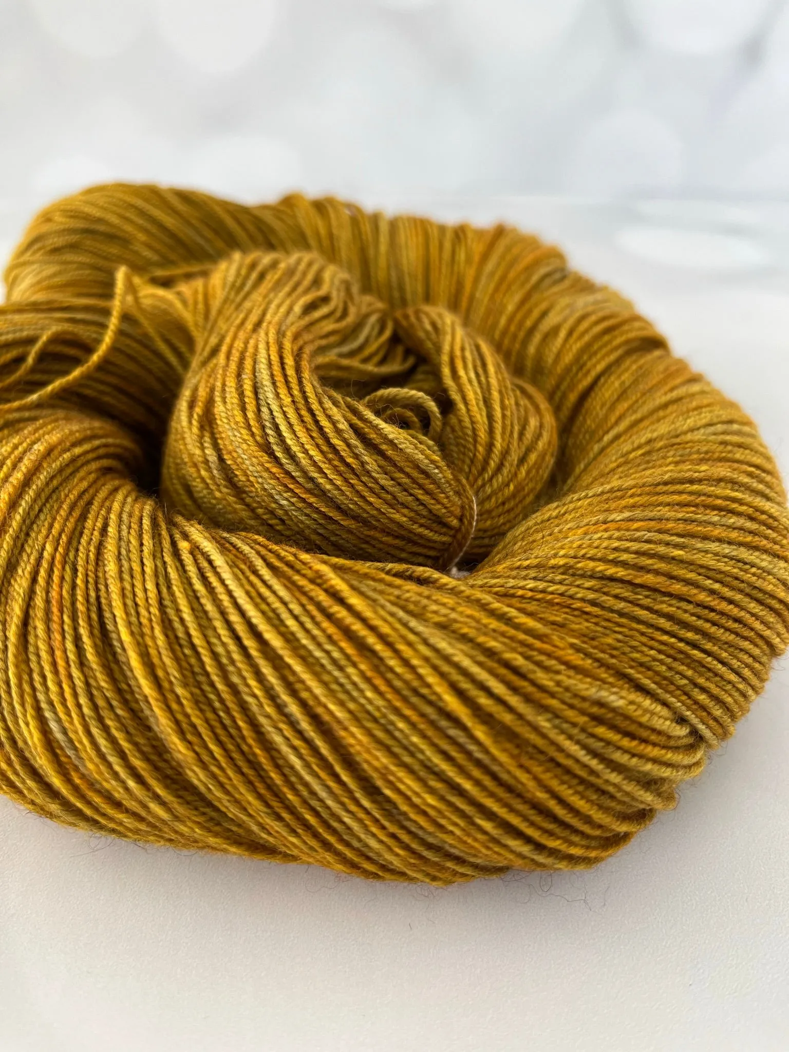 Tarnished Brass, Treasured Yak Toes Sock Yarn, goldenrod yellow yarn