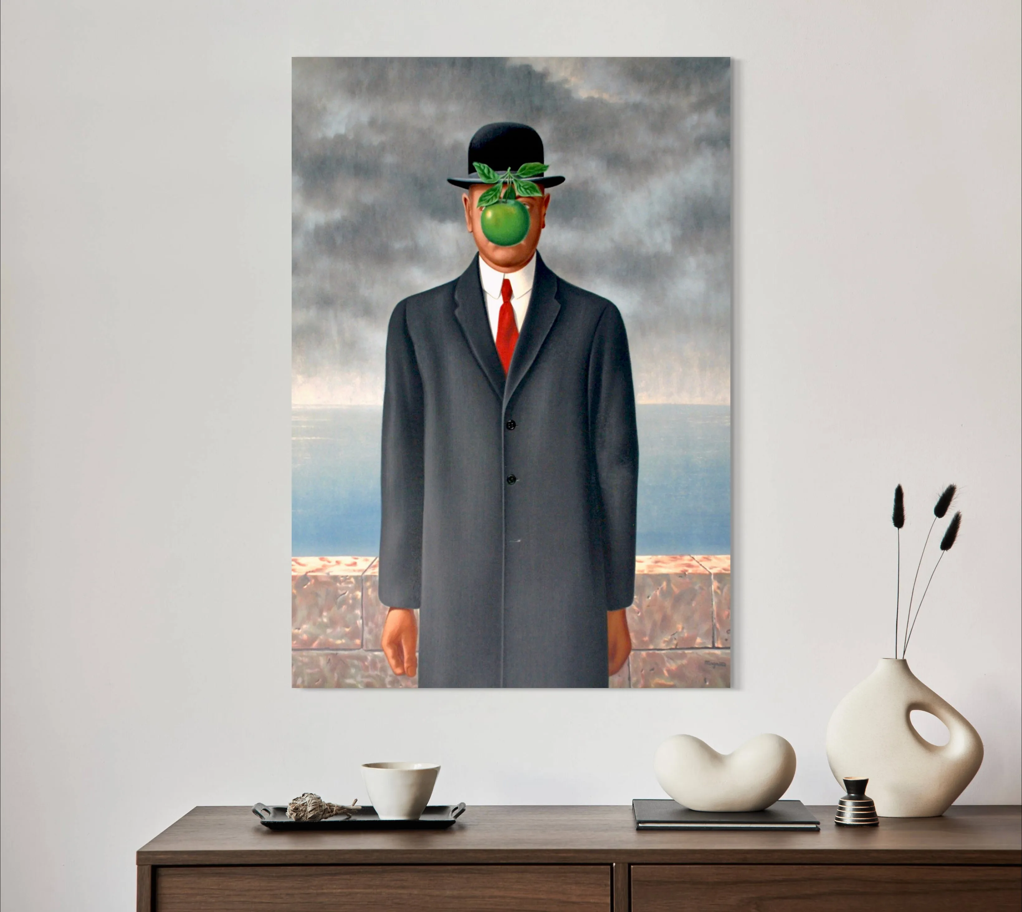 The Son of Man - Painted by Renee Margritte - Circa. 1964. High Quality Polyester Cotton Canvas Print. Ready to be Framed. Available in One Large Size. 70cm X 100cm. Stretched Canvas Option Available in One (1) Large Size - 70cm x 100